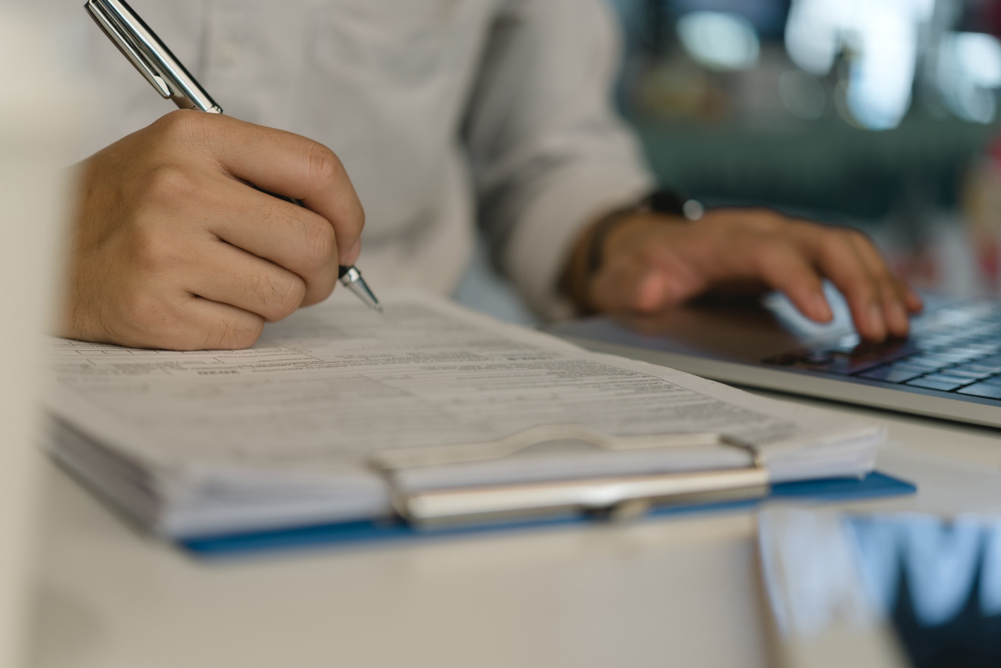 Business person Writing contract law and paper work for business