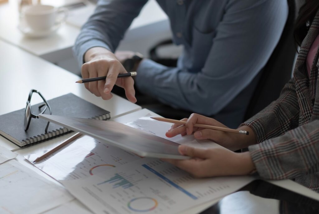Team of business people working together in the meeting room office, teamwork background charts and